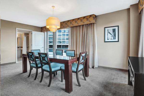 Photo of luxury modern living room area with dining table with chairs